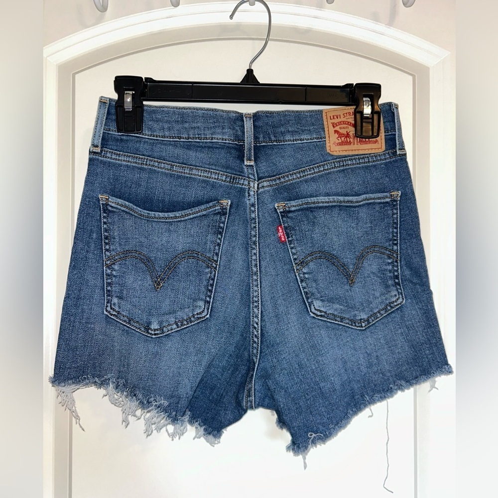 Levi’s medium wash mile high cut off denim shorts